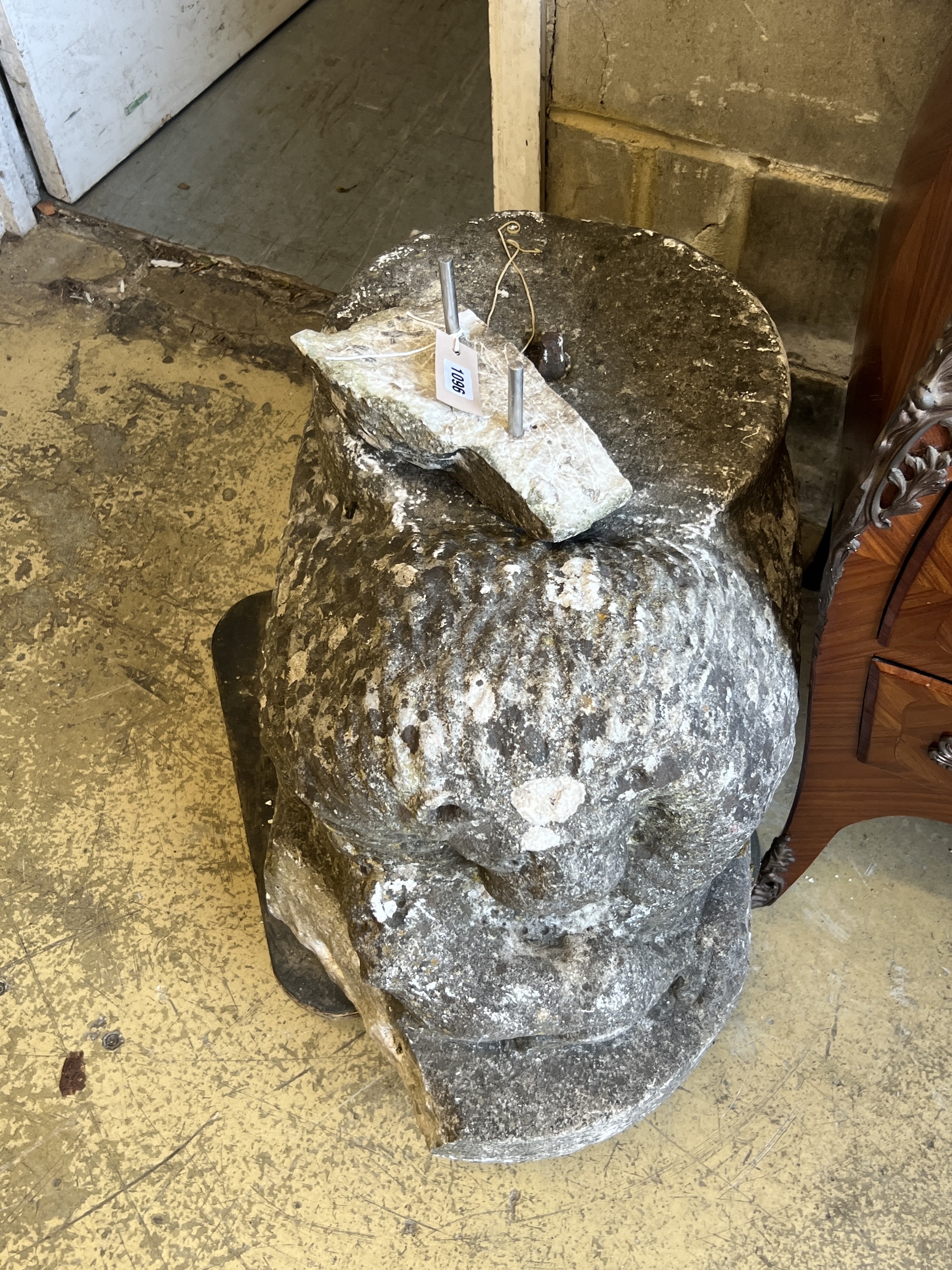 A carved stone lion, (probably antique and a column support) length 84cm, depth 40cm, height 45cm